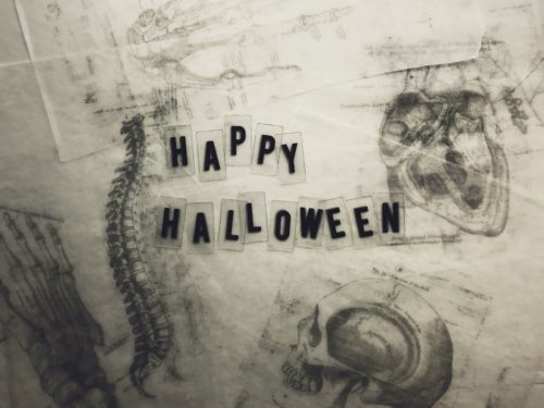 "Happy Halloween" surrounded by illustrations of bones